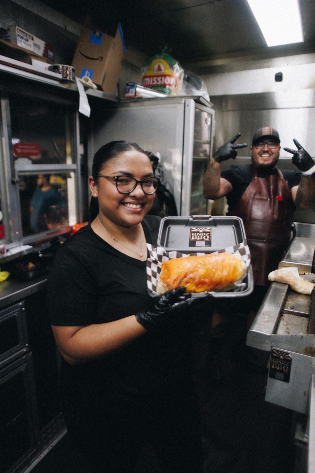 HNDZ BBQ team presenting a freshly prepared Big Boss burrito