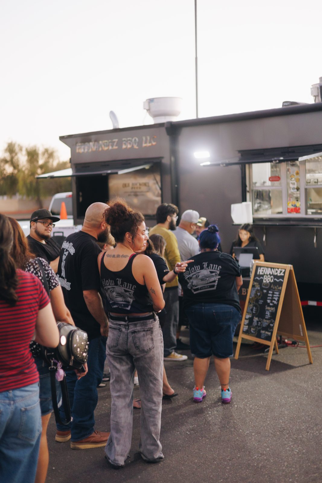 A crowd lined up at the HNDZ BBQ food truck